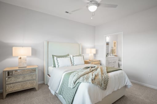 a bedroom with a bed and a mirror