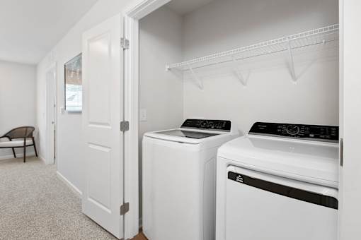 A laundry room with a washer and dryer.