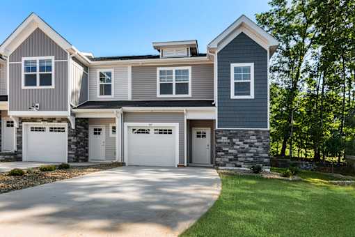 A modern two-story house with a garage.