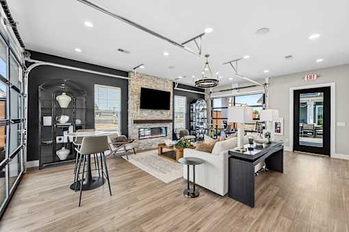 A modern living room with a bar area and a television.