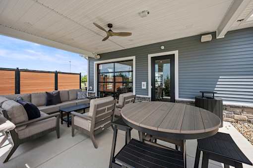 A patio with a table and chairs is shown.
