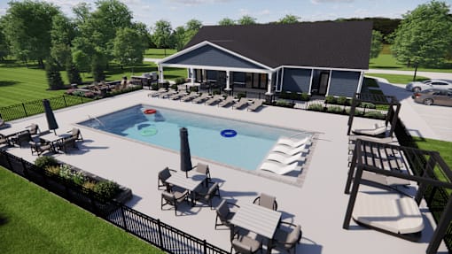 A pool with a slide and sun loungers.