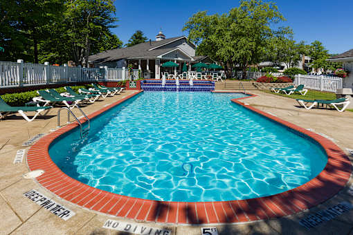 A pool with the words "NO DIVING" written on the ground.