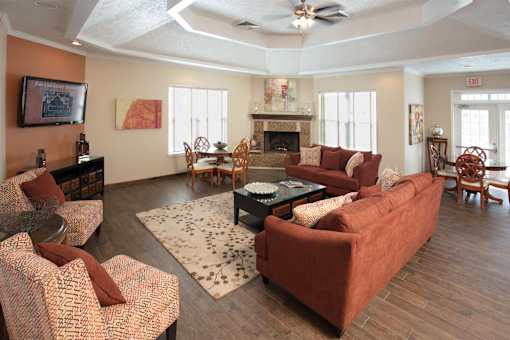 A living room with a fireplace and a couch.