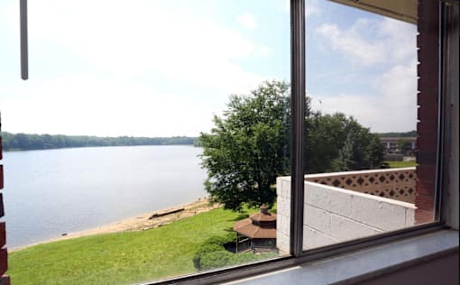 A view of a lake from a window.