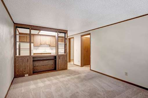 A kitchen area with a sink and cabinets.