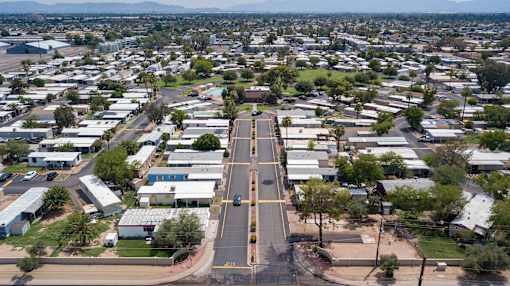 A view of a city from above with buildings and roads.