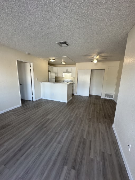 a view of the kitchen and living room from the top of the stairs