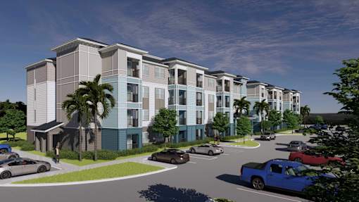 A modern apartment complex with a parking lot in front.