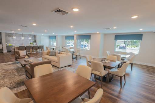 A large room with a long table and chairs.