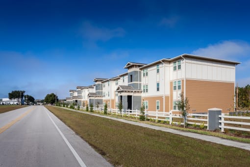 a row of houses on the side of a road