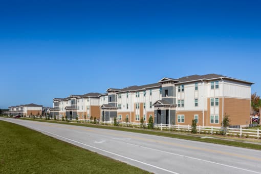 a row of houses on the side of a road
