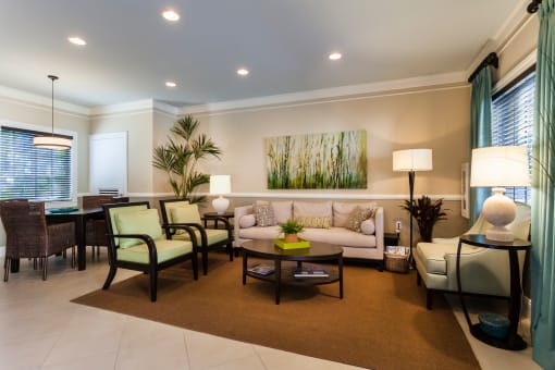 a living room filled with furniture and a large window