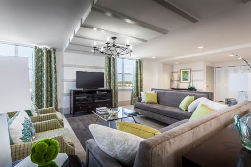 a living room filled with furniture and a large window