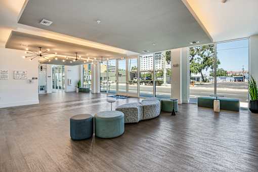 A spacious room with a long table and chairs.