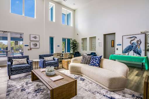 A living room with a blue couch and a coffee table.