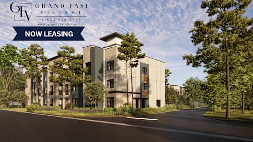 A building with the sign "Grand East Village" is now leasing.