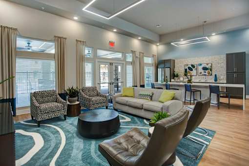 A modern living room with a round coffee table and a sofa.
