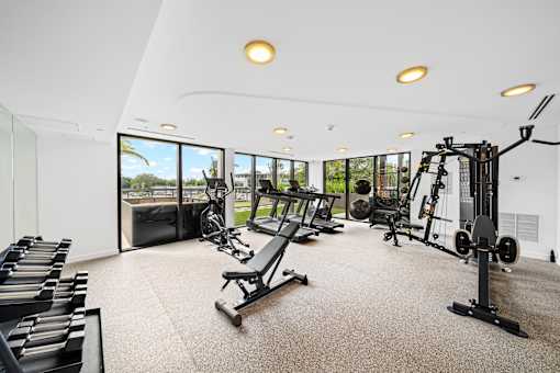 A spacious home gym with a variety of equipment.