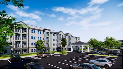 A large building with a parking lot in front of it.