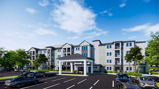A large building with a parking lot in front of it.