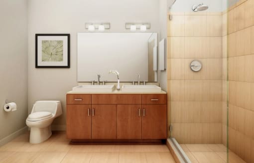 a bathroom with a toilet sink and shower  at The Sheffield Englewood, Englewood, New Jersey