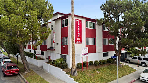 A red and white building with the words "LEASING" and "310" on it.