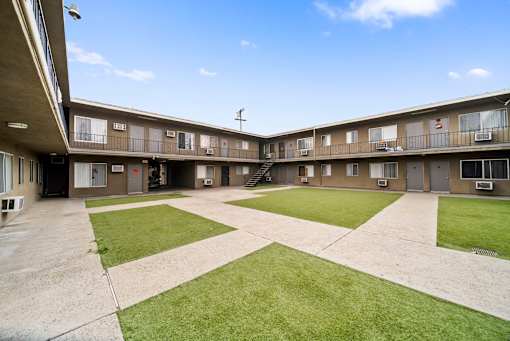 A sunny day at the courtyard of apartment buildings.