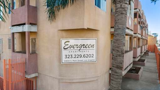 The building is called Evergreen Apartments.