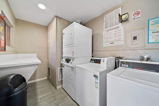A laundry room with a washer and dryer stacked on top of each other.