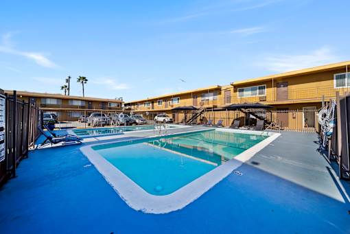 A swimming pool with a blue tinted water.