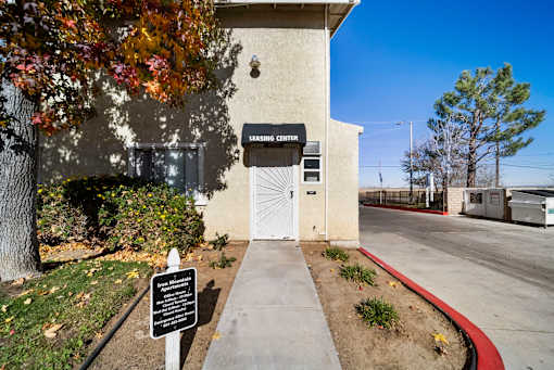 A sign in front of a building that says "LEARNING CENTER".