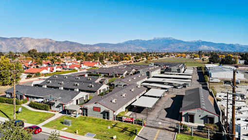 A suburban area with houses and a mountain range in the background.
