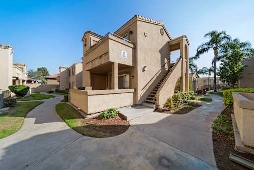 A concrete staircase leads up to a building entrance.