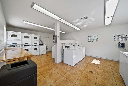 A laundry room with washers and dryers.