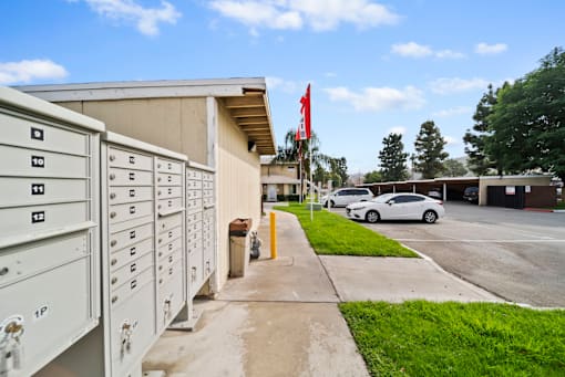 A white mailbox with the number 12 on it is on the left side of the image.