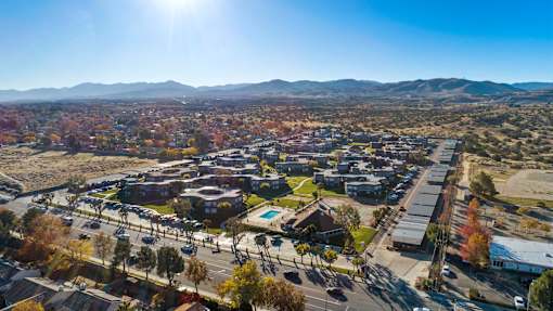 A sunny day in a suburban area with a view of the mountains in the distance.