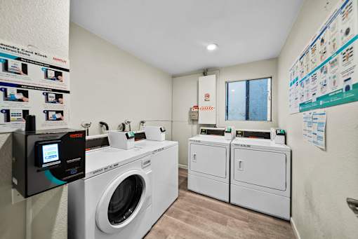 A laundry room with a washing machine and a dryer.
