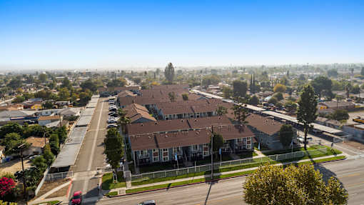 A residential area with houses and a clear sky.