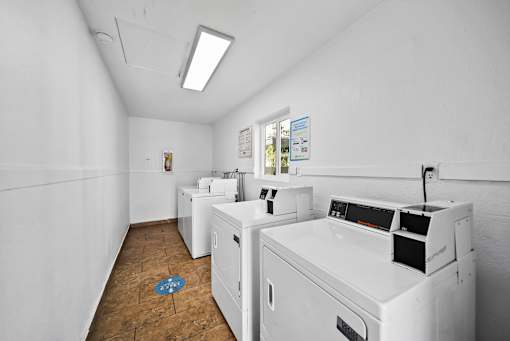 A laundry room with a washer and dryer.