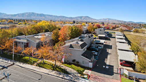 A view of a residential area with houses and trees.
