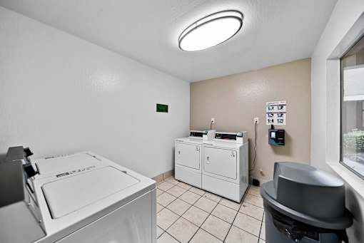 A laundry room with a washer and dryer.