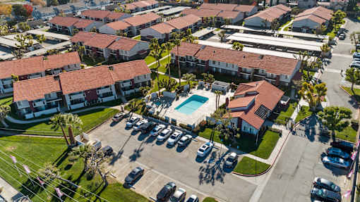 A residential area with houses and a swimming pool.