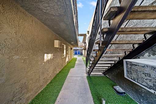 A stone wall with a staircase on the right side.