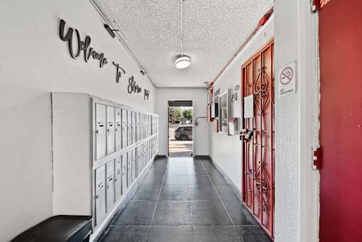 A long hallway with a sign that says "Where To Shim".