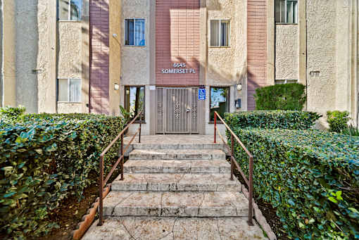 The image shows a building entrance with a sign that reads "6645 SOMERSET PL".