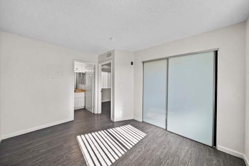 A room with a striped rug on the floor.