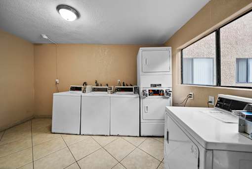 A laundry room with a washer and dryer.