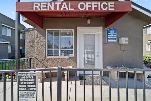 A rental office building with a sign that says "future resident and office parking only".