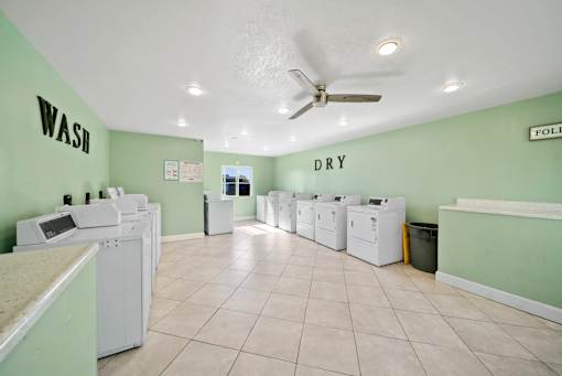 A laundromat with wash and dry sections.